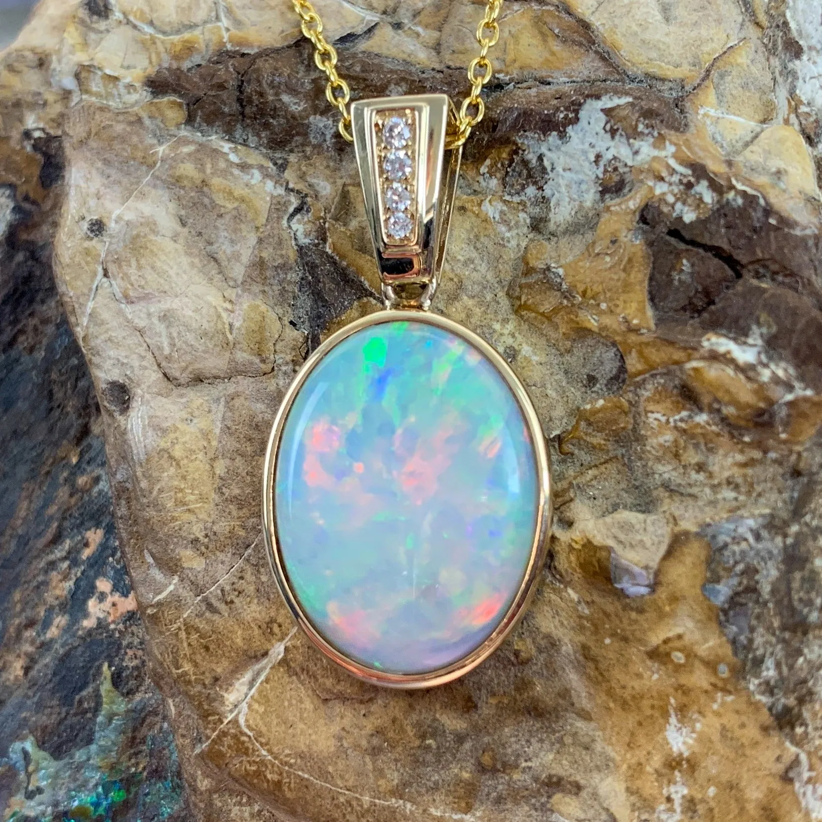 14kt Yellow Gold bezel set Oval Light Opal and diamond pendant