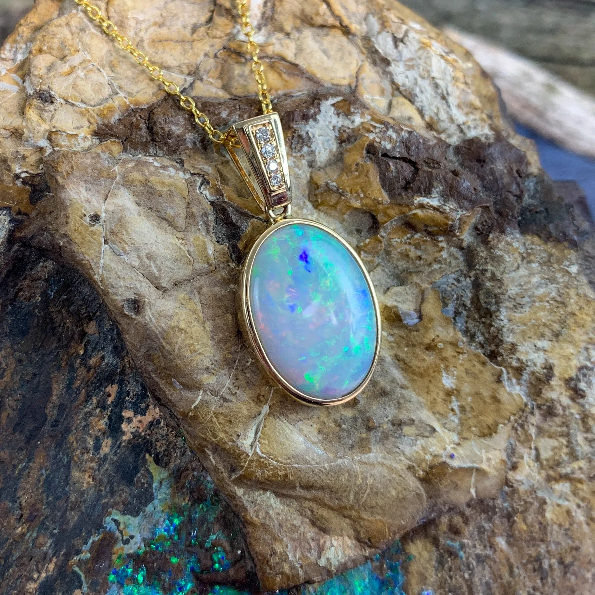 14kt Yellow Gold bezel set Oval Light Opal and diamond pendant
