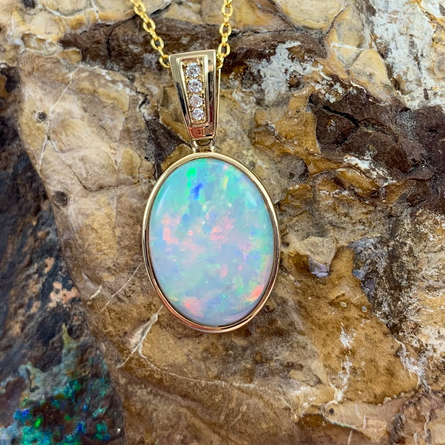 14kt Yellow Gold bezel set Oval Light Opal and diamond pendant