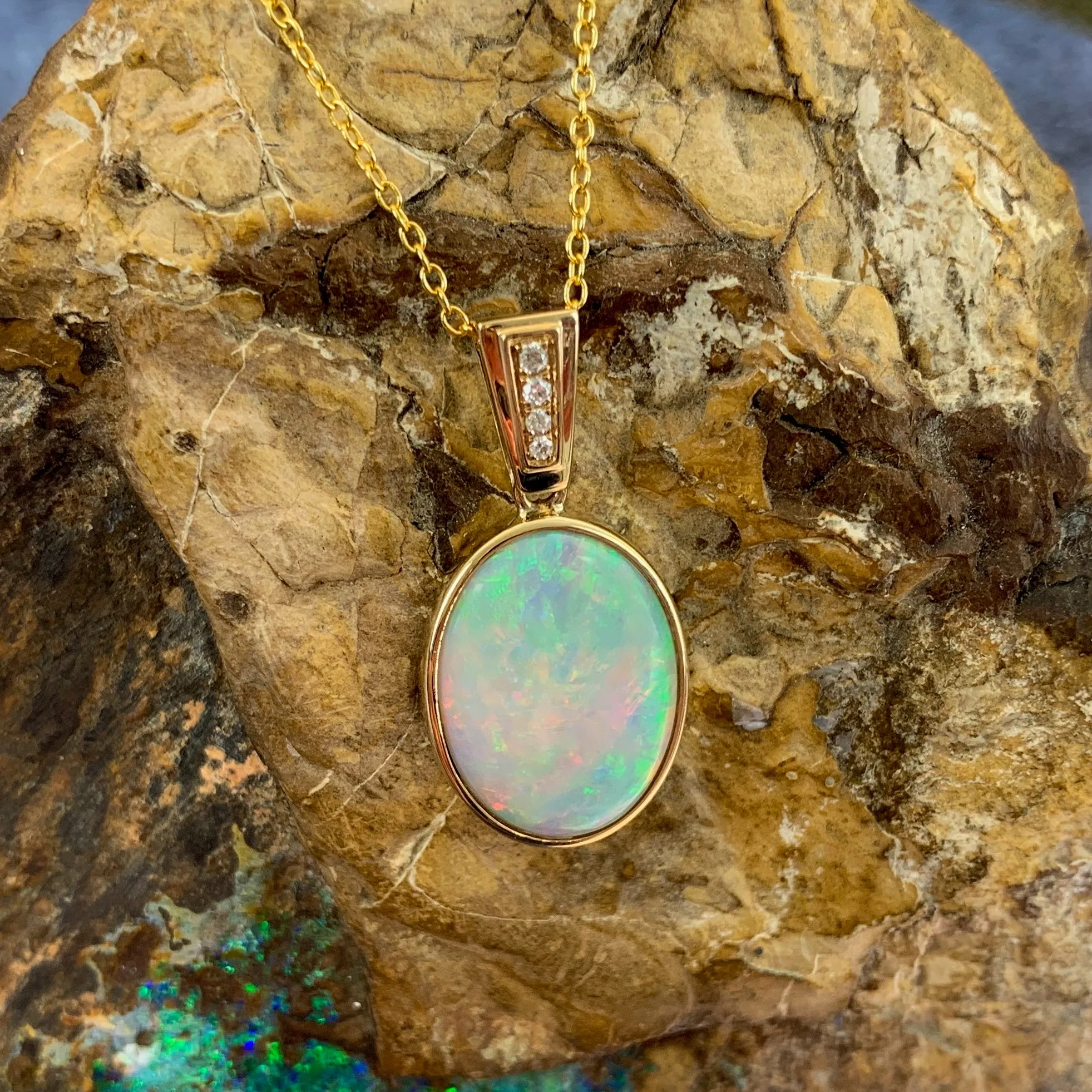 14kt Yellow Gold bezel set Oval Light Opal and diamond pendant