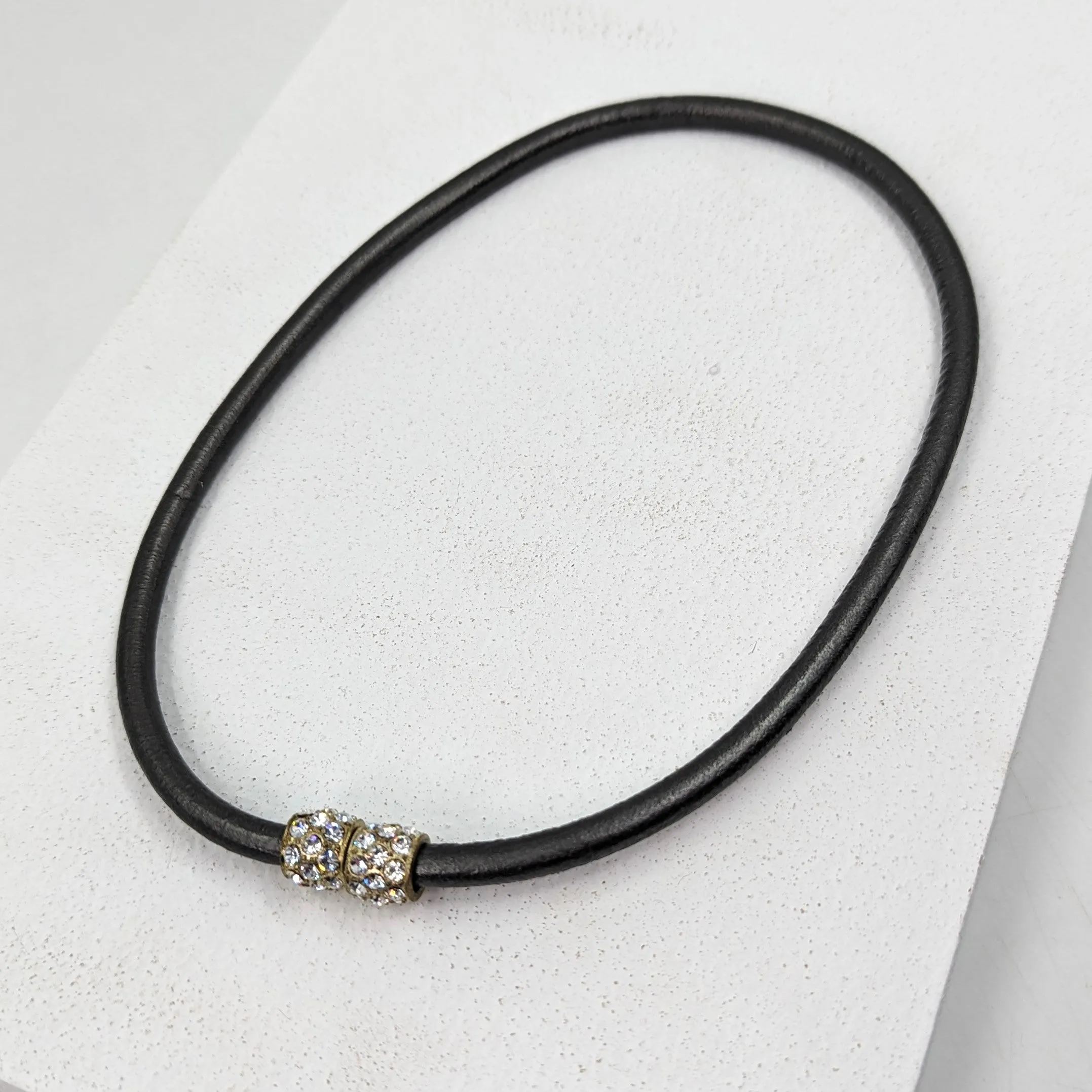 Delicate leather stranded necklace with diamante top feature